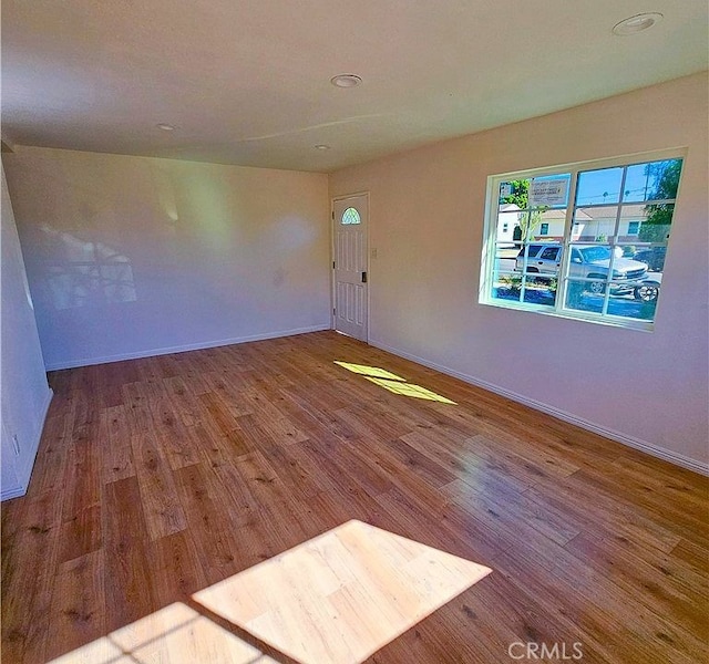 spare room featuring hardwood / wood-style floors