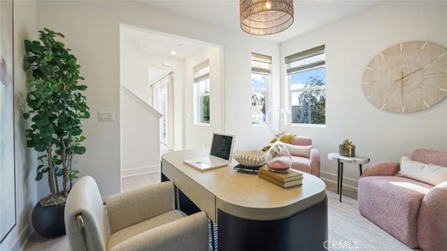 living area with hardwood / wood-style floors