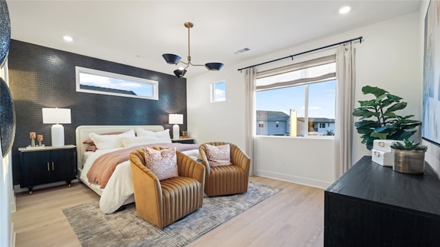 bedroom with light hardwood / wood-style floors