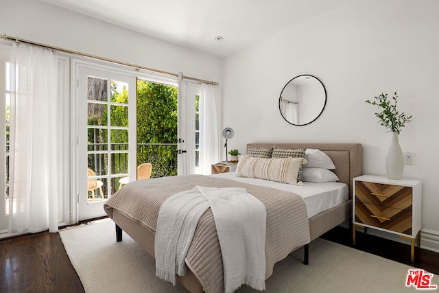 bedroom featuring access to exterior and wood-type flooring