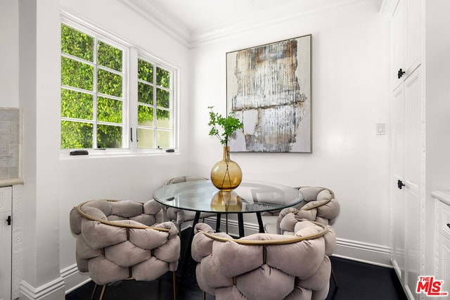 dining space featuring ornamental molding