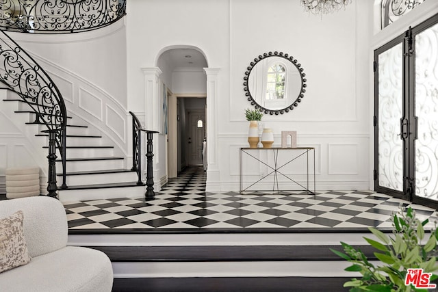 foyer entrance featuring french doors