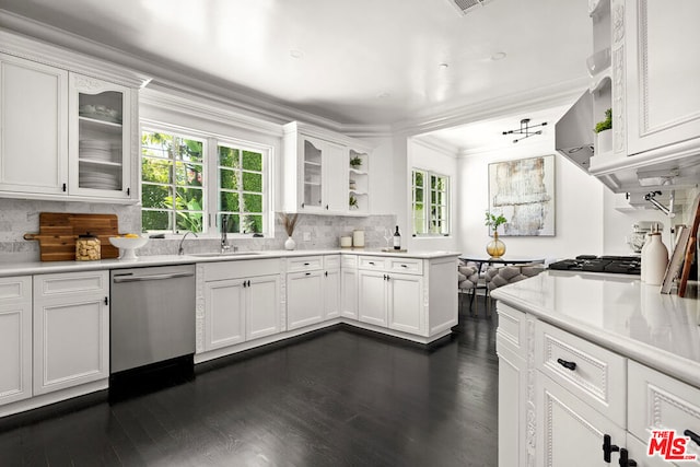 kitchen featuring white cabinets, appliances with stainless steel finishes, sink, and ornamental molding