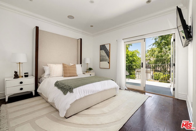 bedroom with crown molding, wood-type flooring, and access to outside