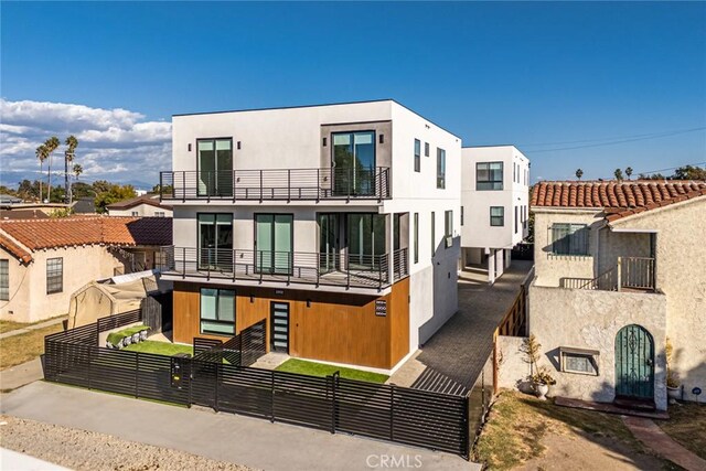 back of house with a balcony