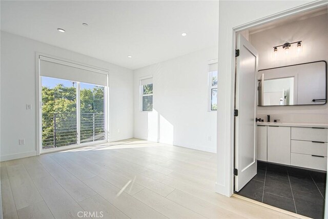 interior space featuring light wood-type flooring and sink