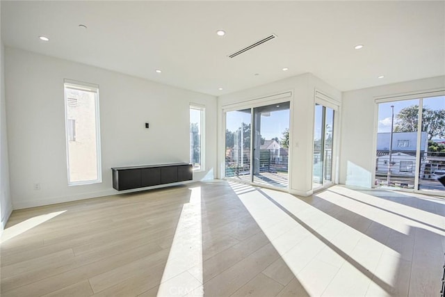 interior space with a healthy amount of sunlight and light hardwood / wood-style floors