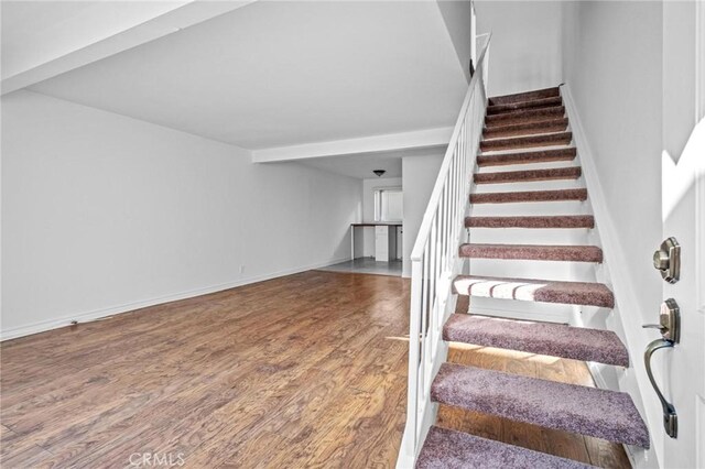 stairway featuring hardwood / wood-style flooring