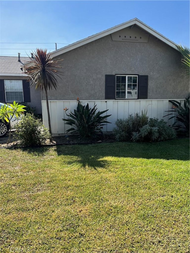 view of home's exterior featuring a yard