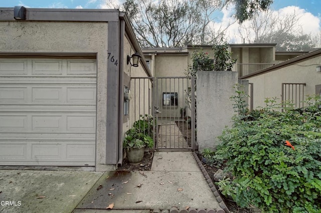 view of gate featuring a garage