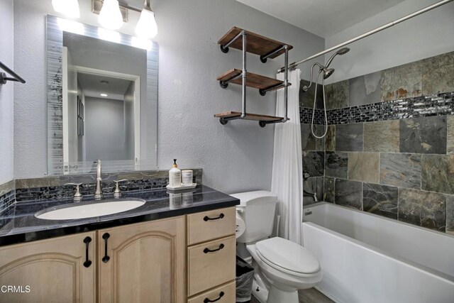 full bathroom featuring toilet, vanity, and shower / bath combo