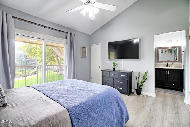 bedroom with ceiling fan, vaulted ceiling, access to outside, light wood-type flooring, and connected bathroom