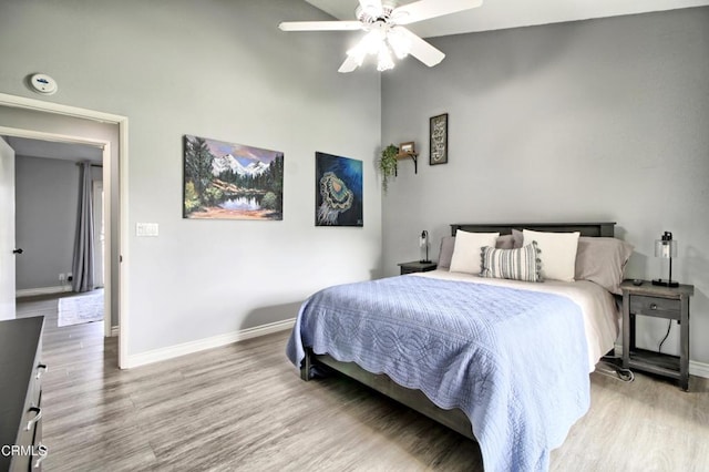 bedroom featuring ceiling fan and light hardwood / wood-style flooring