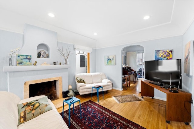living room featuring a fireplace and hardwood / wood-style floors