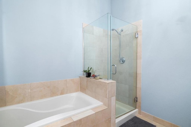 bathroom with tile patterned flooring and plus walk in shower