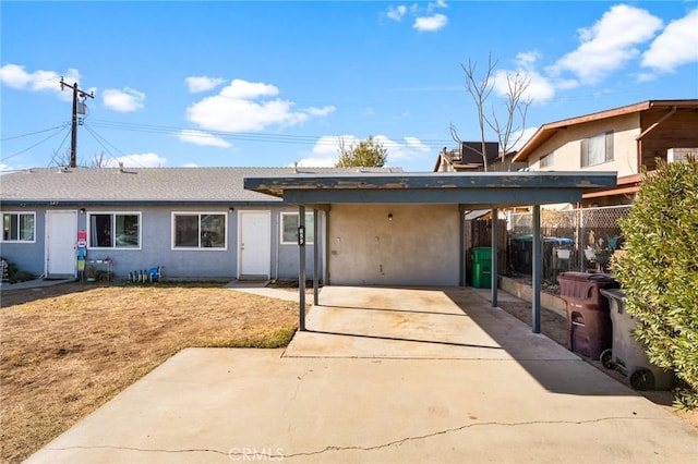 rear view of house with a carport