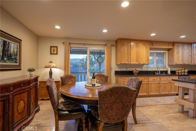 dining room featuring light hardwood / wood-style floors and sink