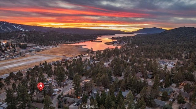 aerial view at dusk with a water and mountain view