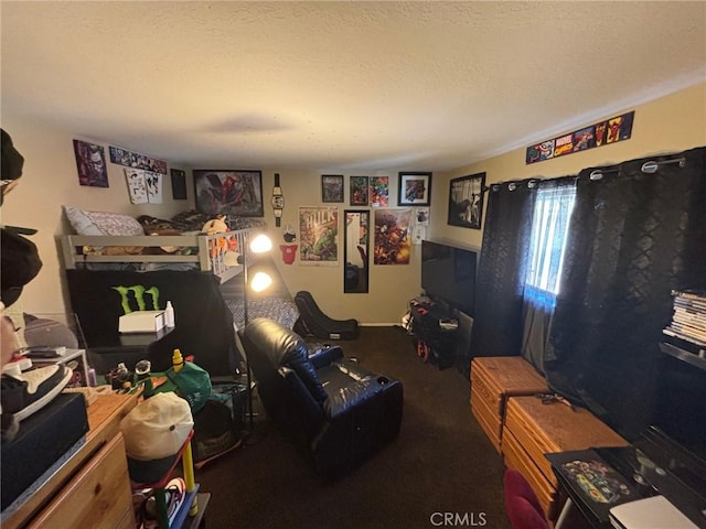 game room with dark carpet and a textured ceiling