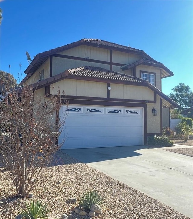 view of side of property with a garage