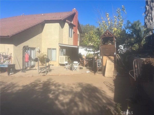 back of property with a patio area