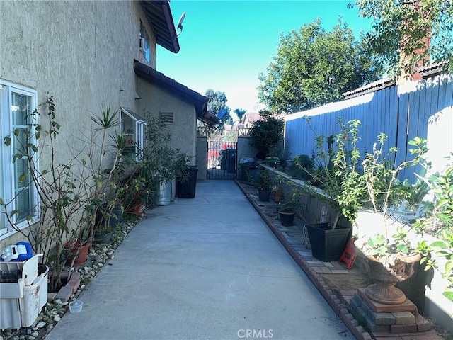 view of property exterior with a patio area