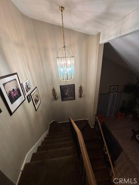 stairway with lofted ceiling