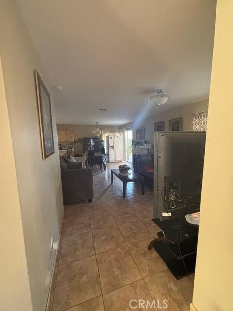 hallway with tile patterned flooring