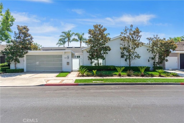 single story home featuring a garage