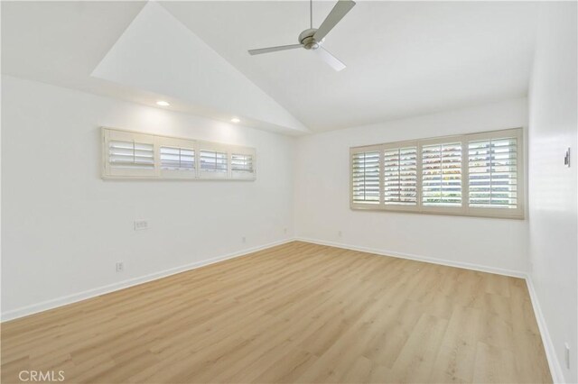 unfurnished room with lofted ceiling, ceiling fan, and light hardwood / wood-style floors