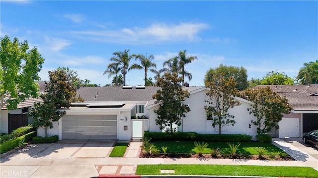 ranch-style home featuring a garage