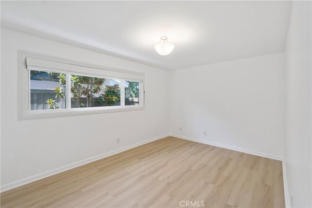 unfurnished room with light hardwood / wood-style floors