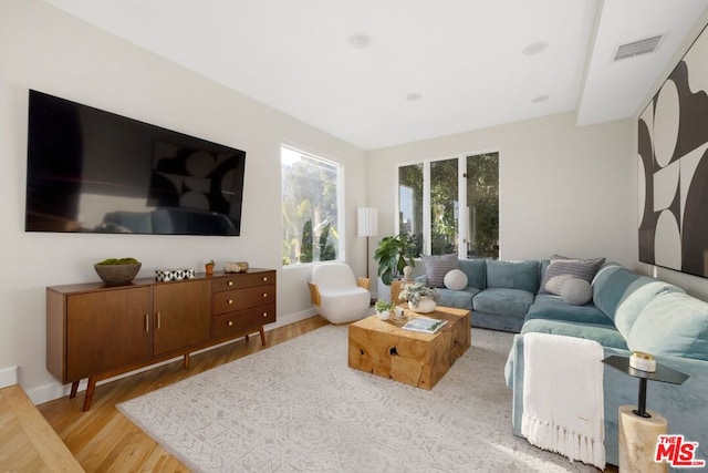 living room with light hardwood / wood-style floors