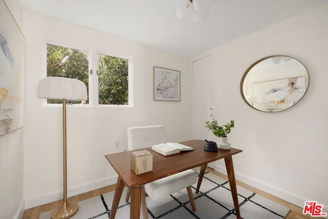 office space with light hardwood / wood-style flooring