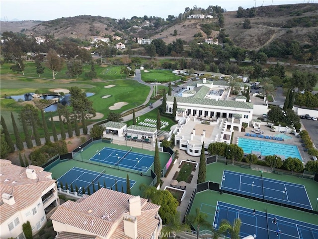 birds eye view of property with a mountain view