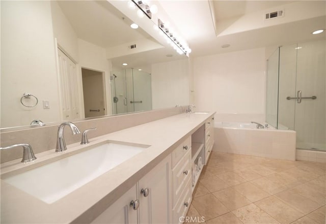 bathroom with separate shower and tub, vanity, and tile patterned floors