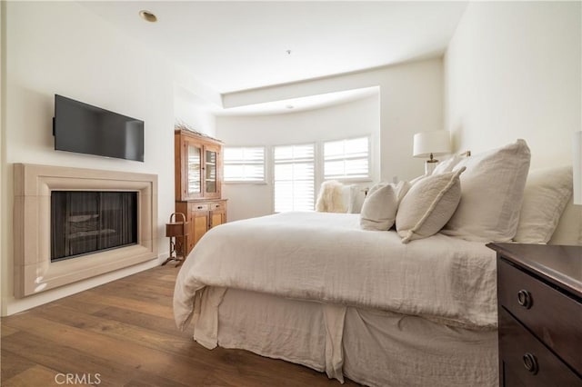 bedroom with hardwood / wood-style floors