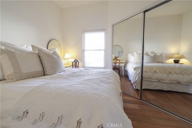 bedroom featuring a closet and hardwood / wood-style flooring