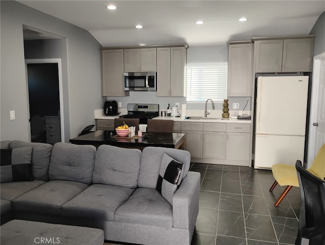 living room featuring recessed lighting and lofted ceiling