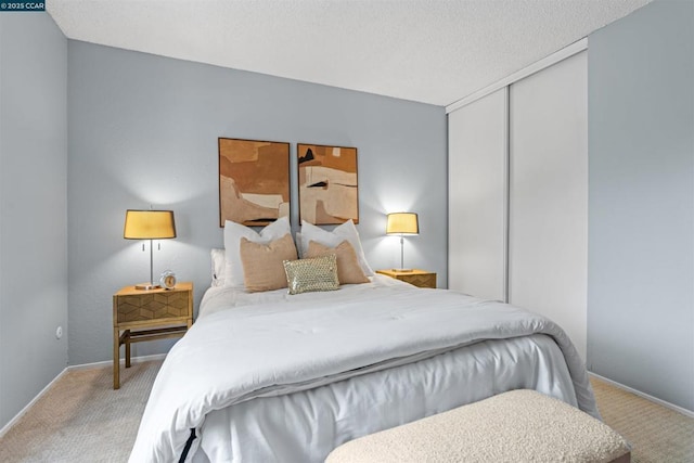 carpeted bedroom featuring a closet