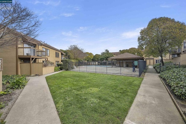 view of yard featuring a fenced in pool