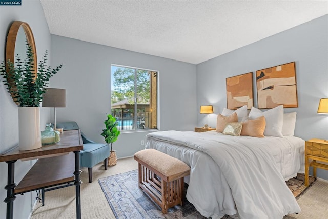 carpeted bedroom with a textured ceiling