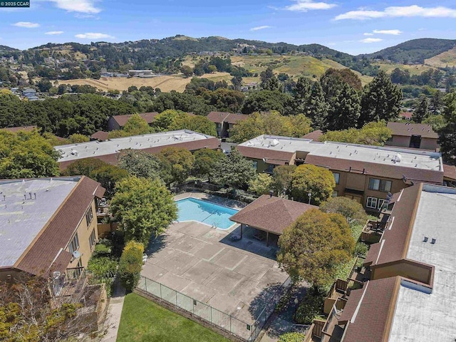 birds eye view of property with a mountain view