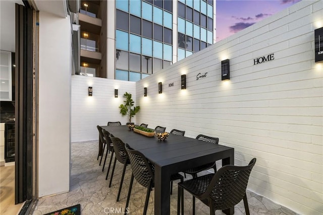 dining area featuring marble finish floor