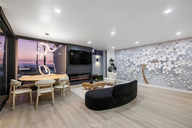 living area with recessed lighting and wood finished floors