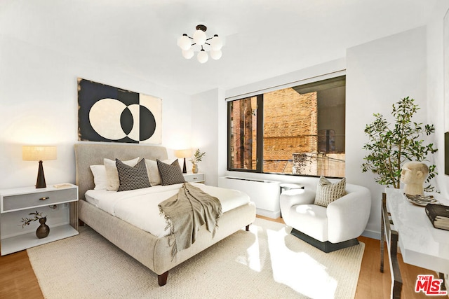 bedroom featuring wood-type flooring