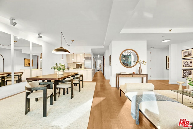 dining room with light wood-type flooring