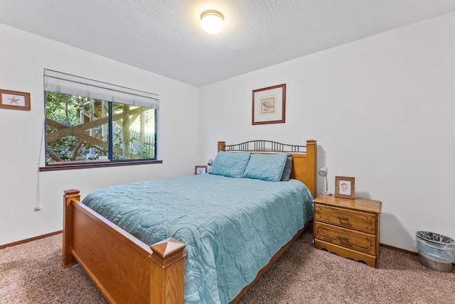 carpeted bedroom with a textured ceiling