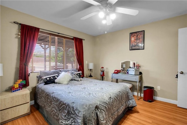 bedroom featuring ceiling fan and hardwood / wood-style flooring