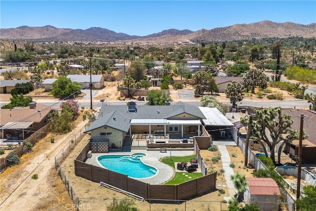 birds eye view of property with a mountain view